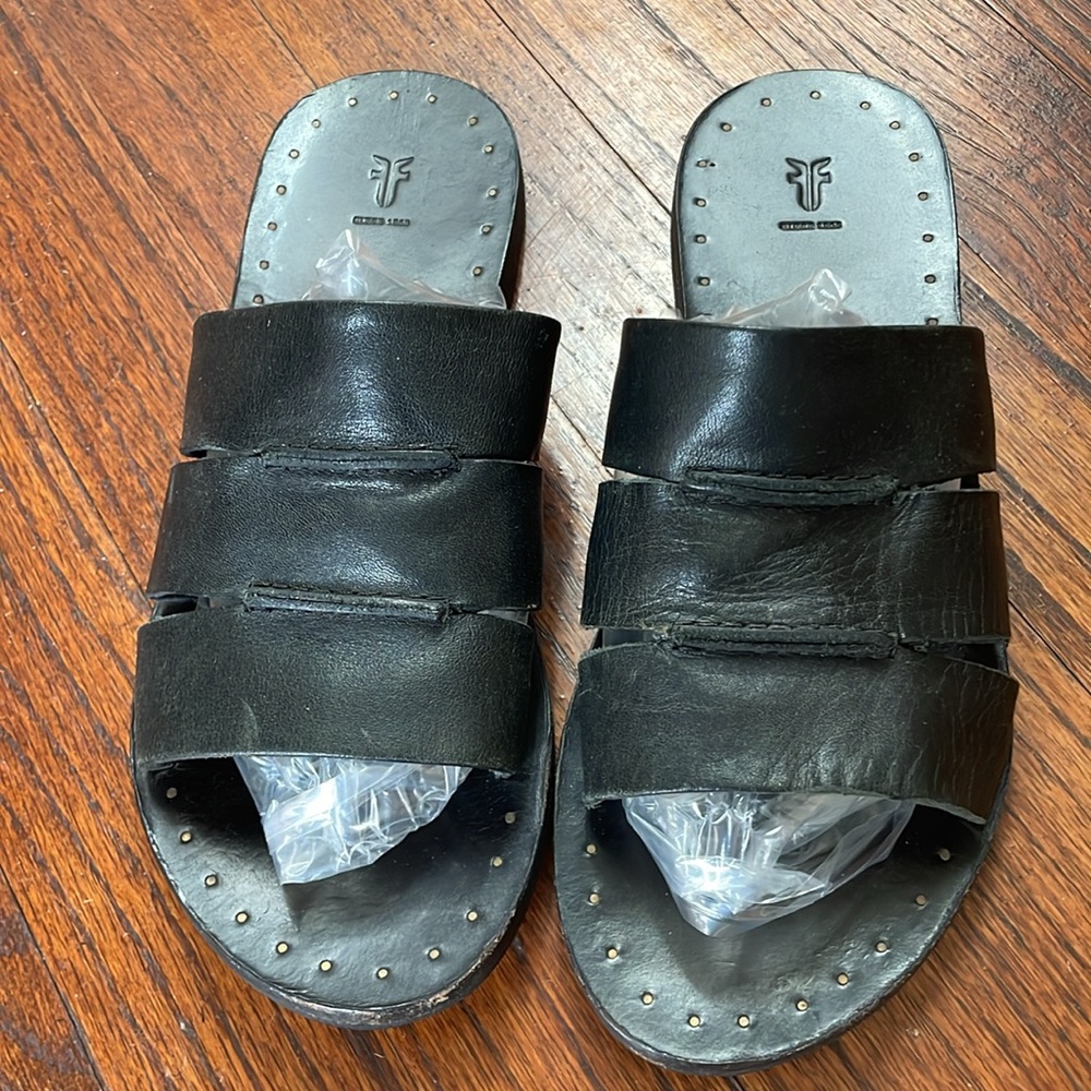 Frye black leather slides.